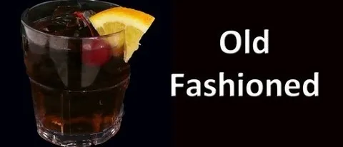 Old Fashioned cocktail with a cherry and orange slice.