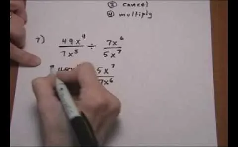 A hand solving a mathematical equation involving fractions and exponents.