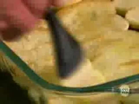 Slicing cake with a black serving utensil.