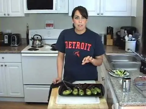 Woman preparing a meal in a modern kitchen.