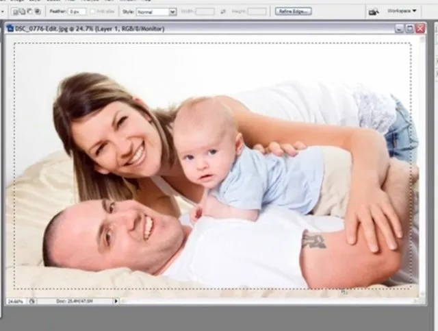 Happy family portrait with parents and a baby.