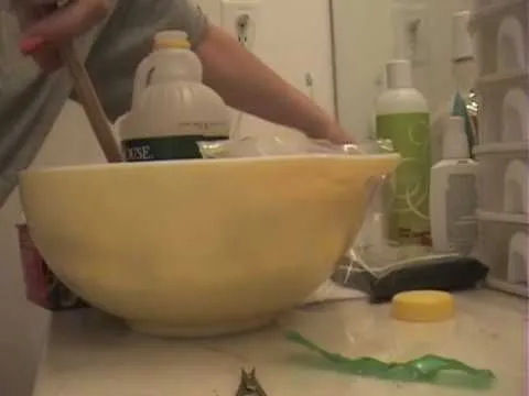 Home cleaning supplies and tools on a bathroom counter.