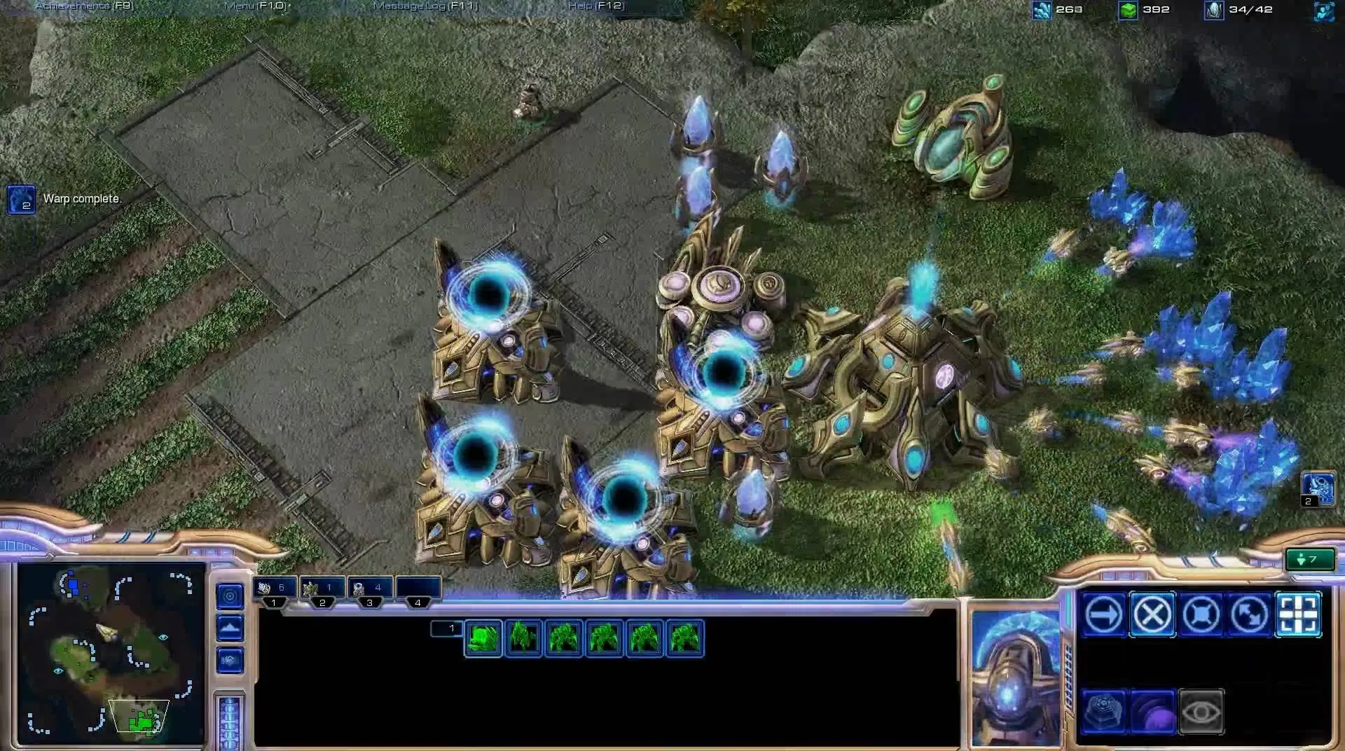 StarCraft II game scene with futuristic structures and units.