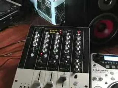 Audio mixer with various controls and input options.