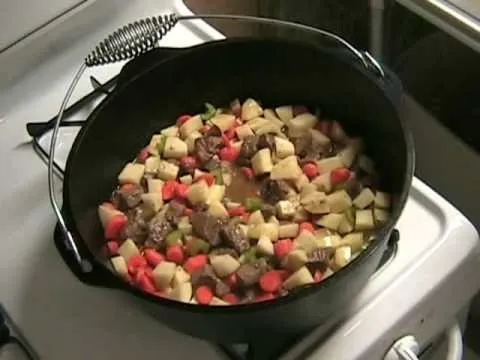A pot of hearty beef stew with vegetables.