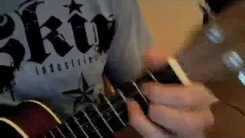 Person playing a ukulele.