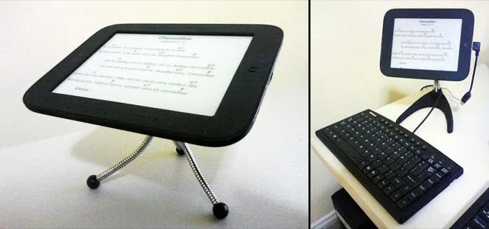 Tablet on stand with keyboard on desk.