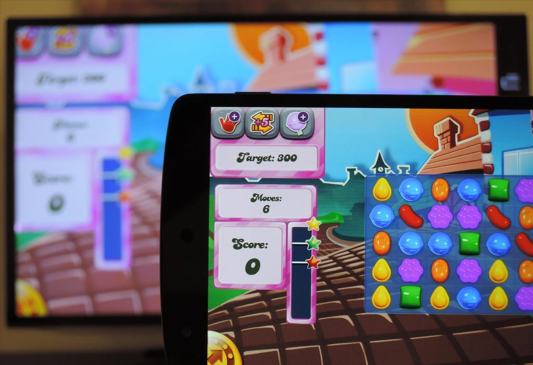 Mobile device displaying a colorful puzzle game interface with a leaderboard in the background.