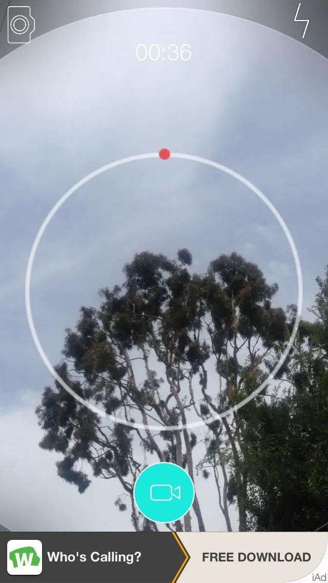 A circular interface displaying a tree against a cloudy sky.