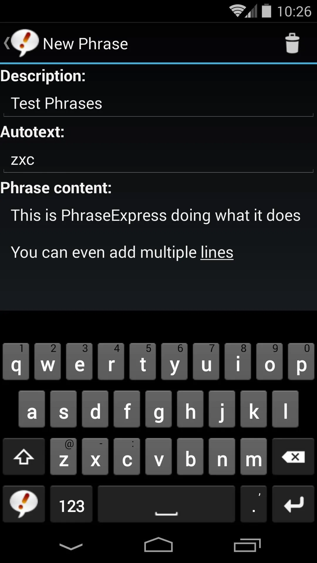 Text input interface for creating a new phrase on a mobile device.