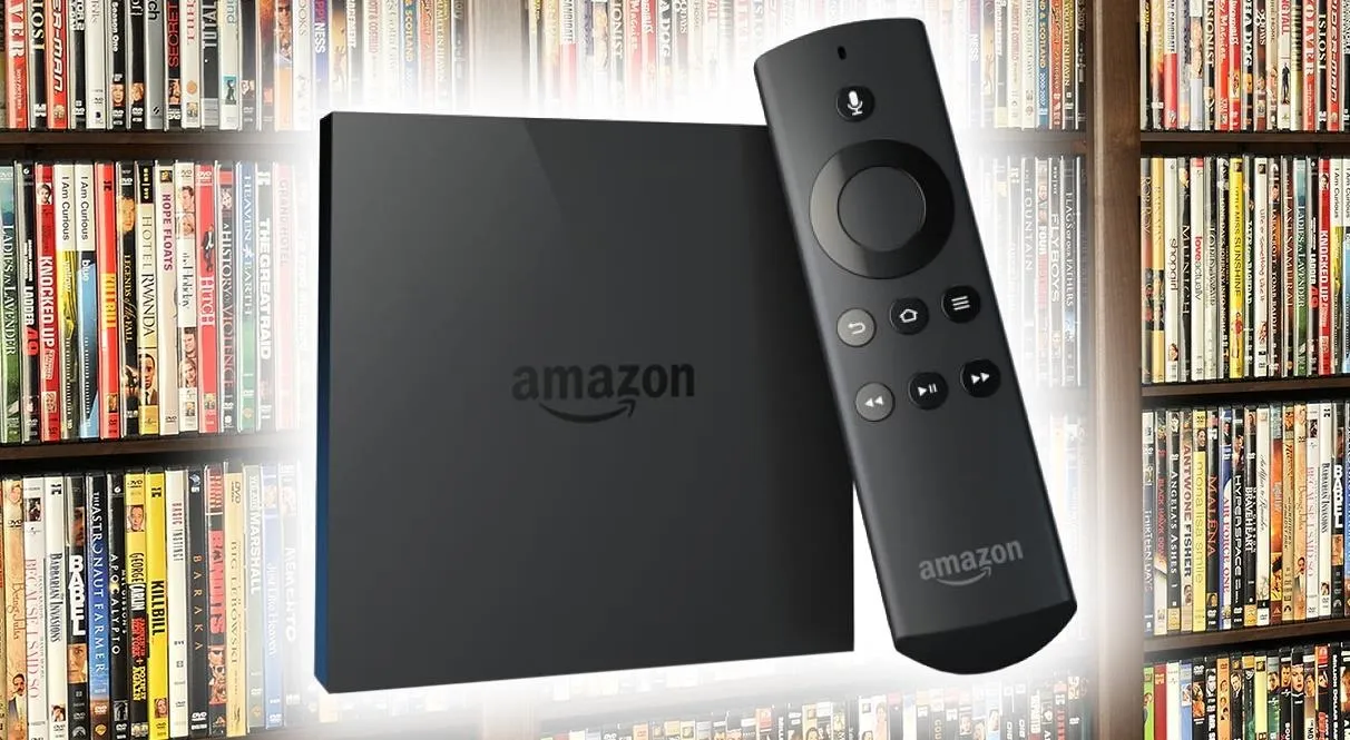 Amazon streaming device with remote control, displayed against a background of DVDs.