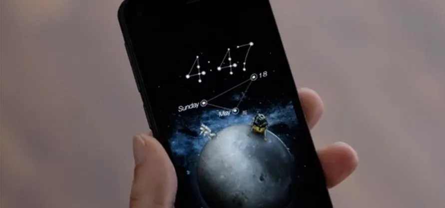 Smartphone displaying a cosmic-themed wallpaper with the time 4:47.