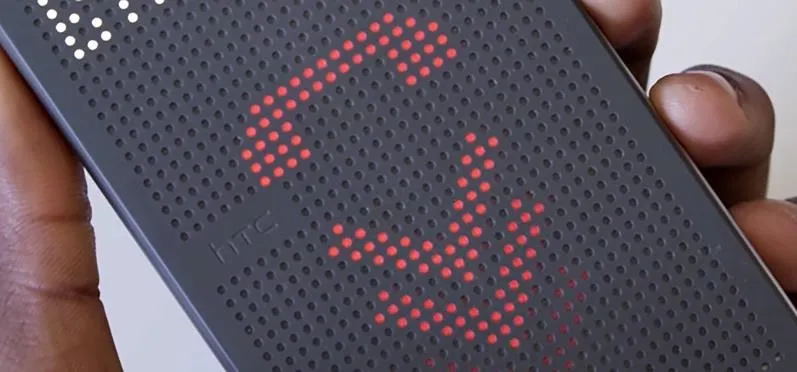 Smartphone displaying a red call icon on a dot matrix screen.