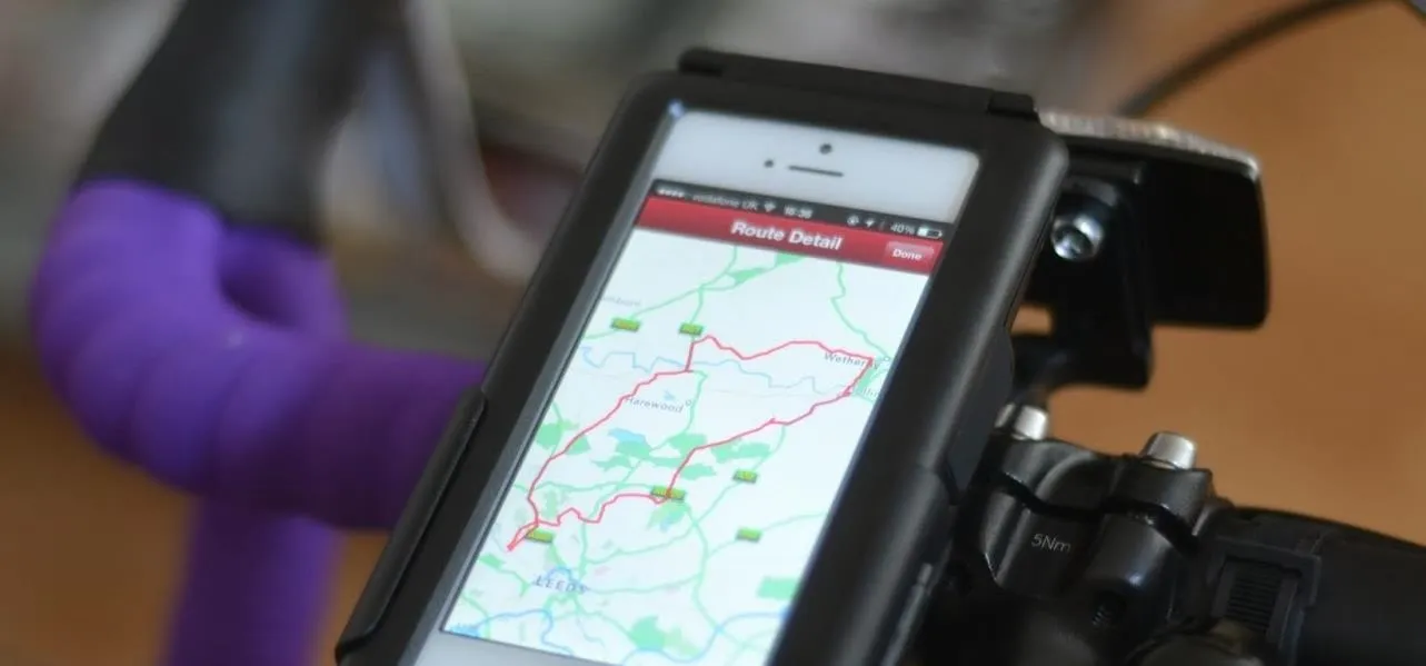 Smartphone mounted on a bicycle displaying a mapping app.