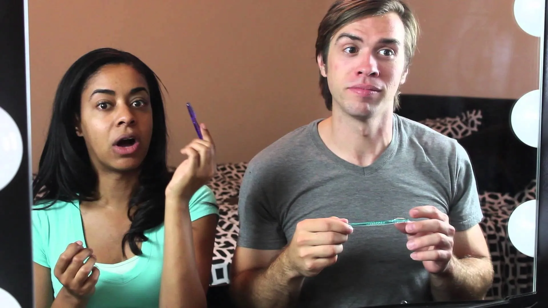 A man applying makeup using a makeup sponge.