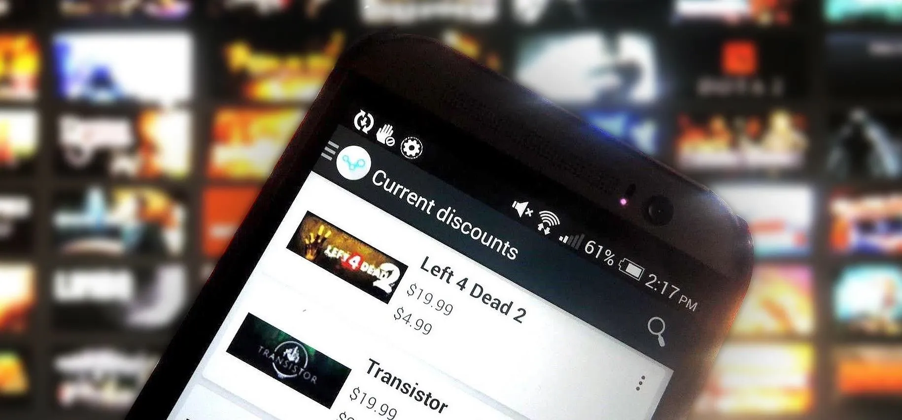 Mobile phone displaying a gaming platform with the game options "Left 4 Dead 2" and "Transistor."