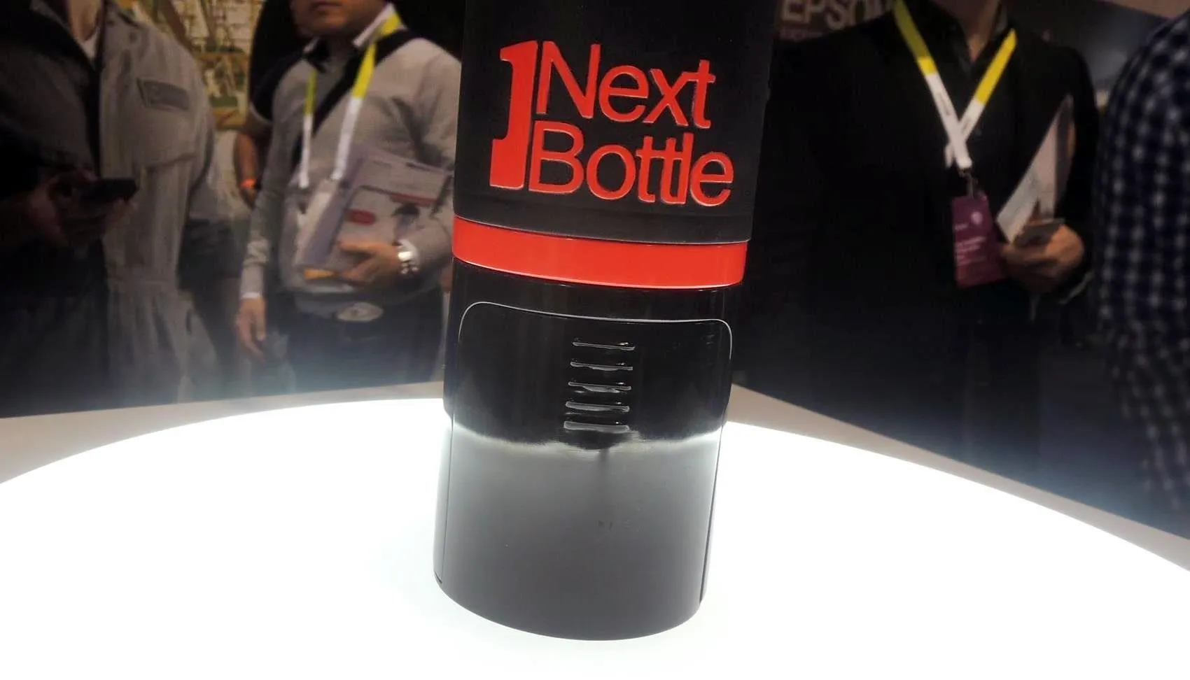 NextBottle product display at a technology expo.