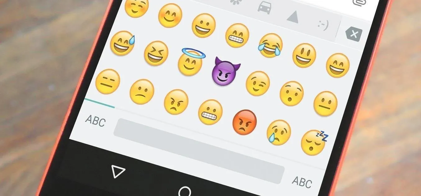 Emoji keyboard with various facial expressions and icons displayed on a smartphone.