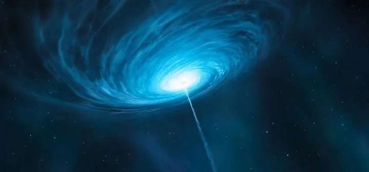 Spiral galaxy emitting a bright blue light.