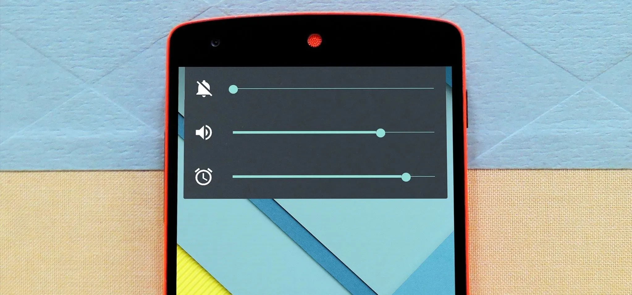 Mobile device showing sound and notification volume sliders.