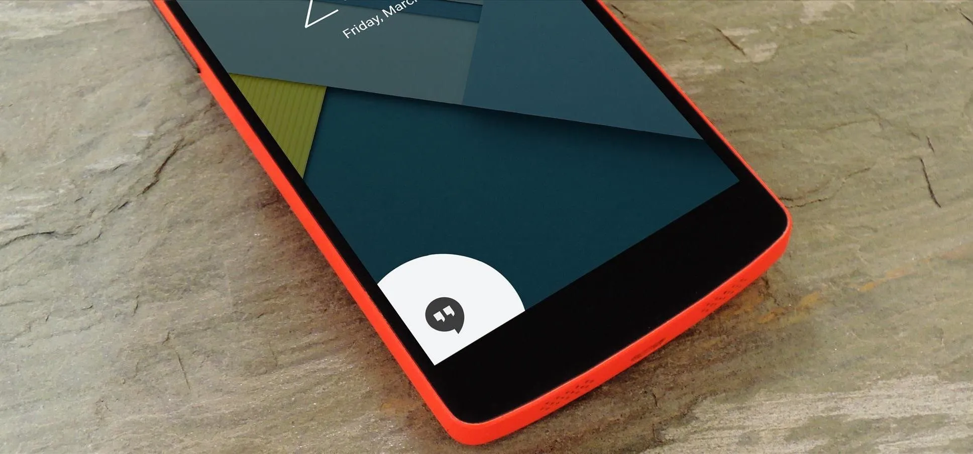 Smartphone with a colorful interface on a textured surface.