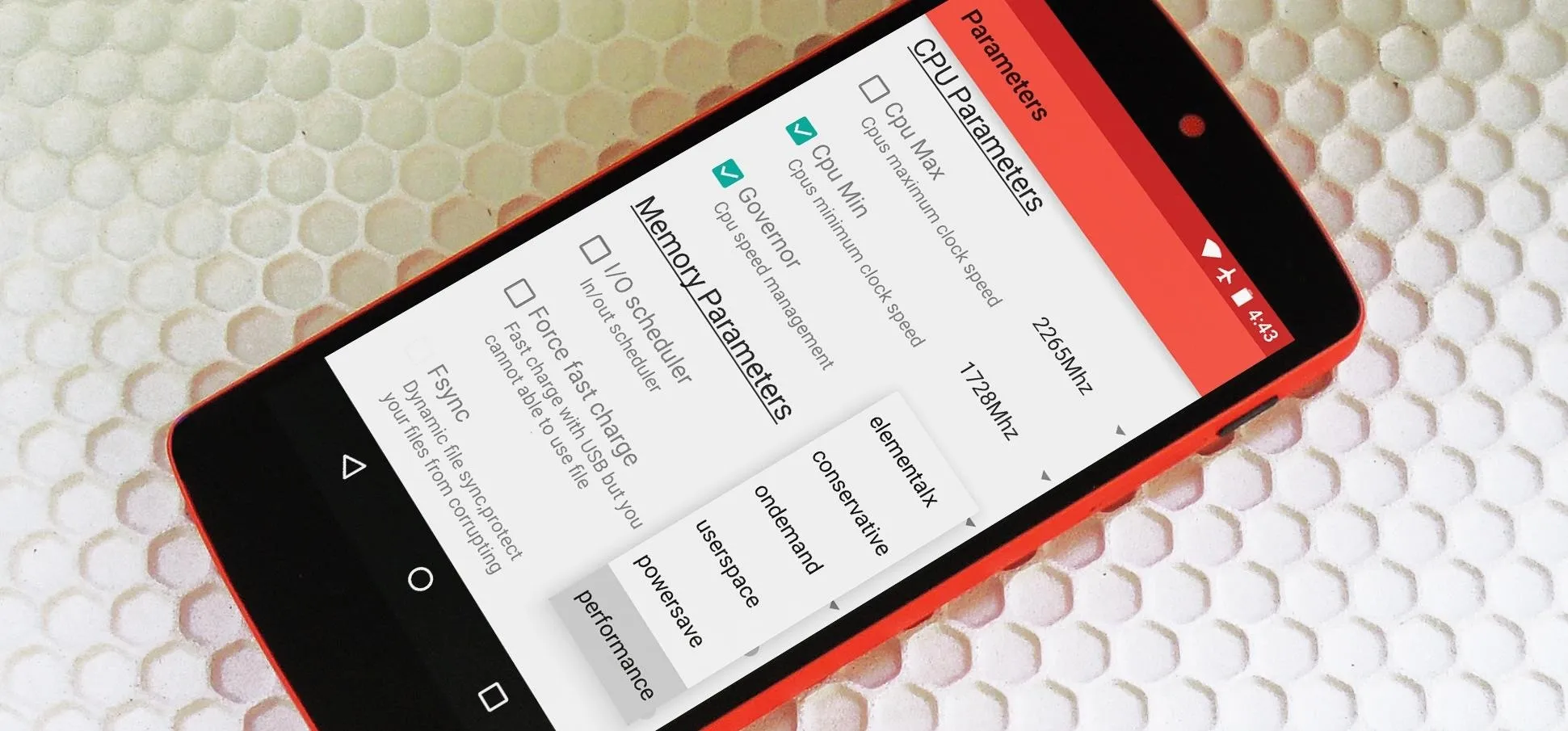 Smartphone displaying app settings on a textured surface.