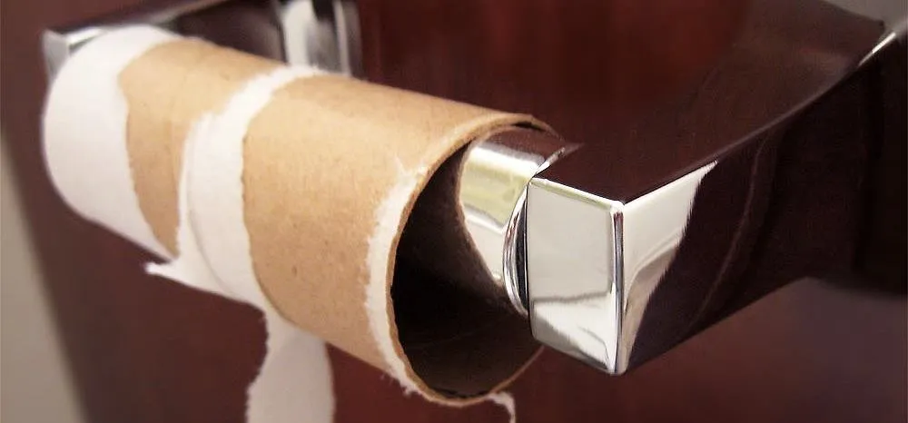 Empty toilet paper roll on a dispenser.