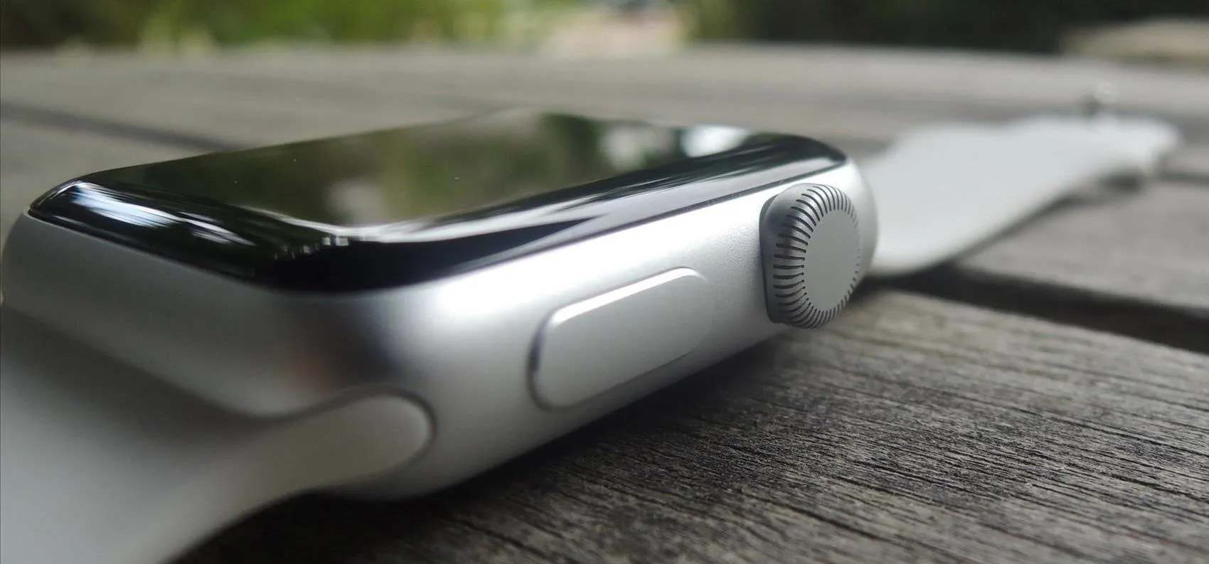 Smartwatch on a wooden surface.