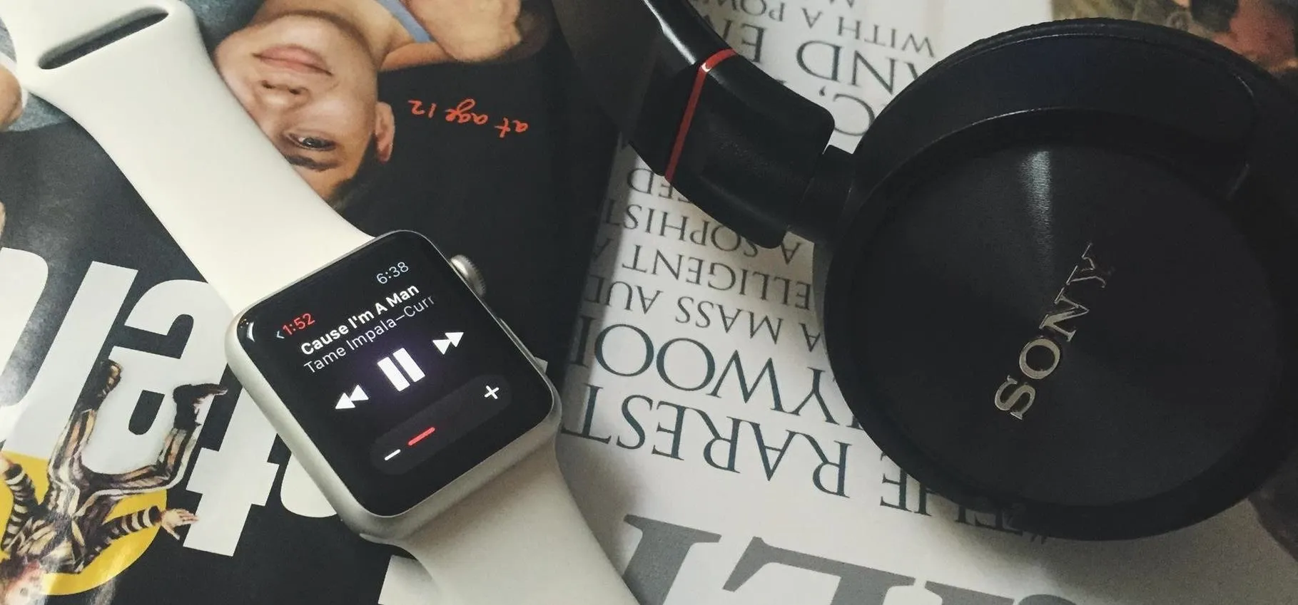 Apple Watch on a wrist displaying the Apple logo.