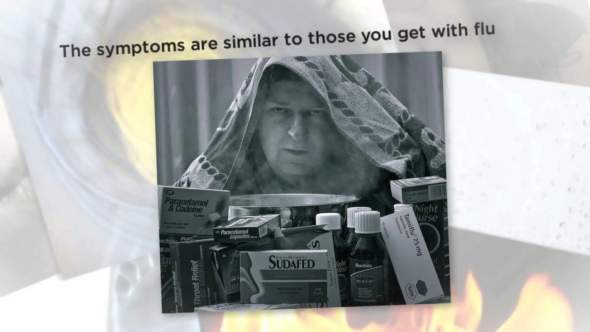 Man sitting under a blanket surrounded by cold medication, conveying flu-like symptoms.