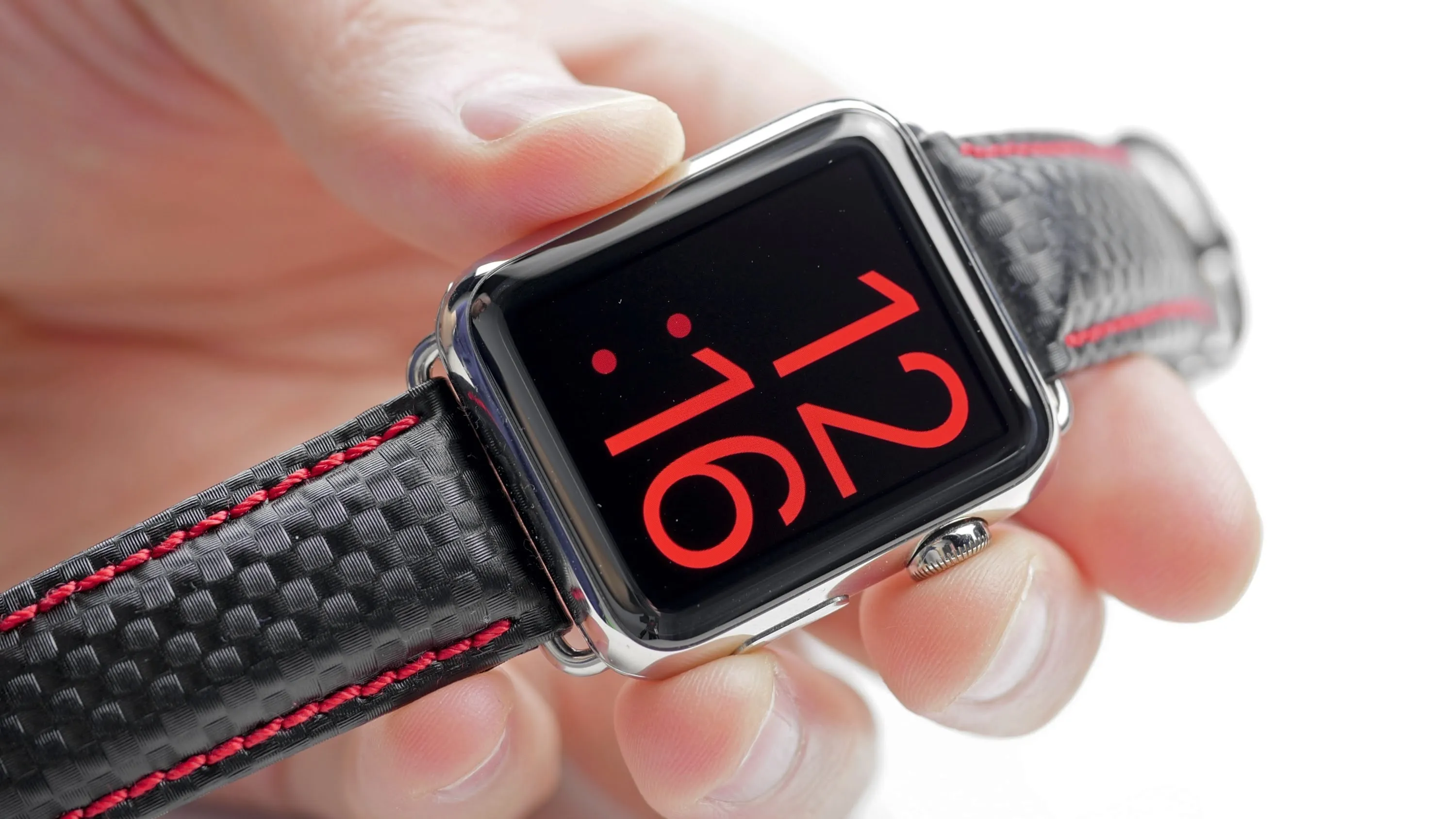 Smartwatch displaying the time in red digits.