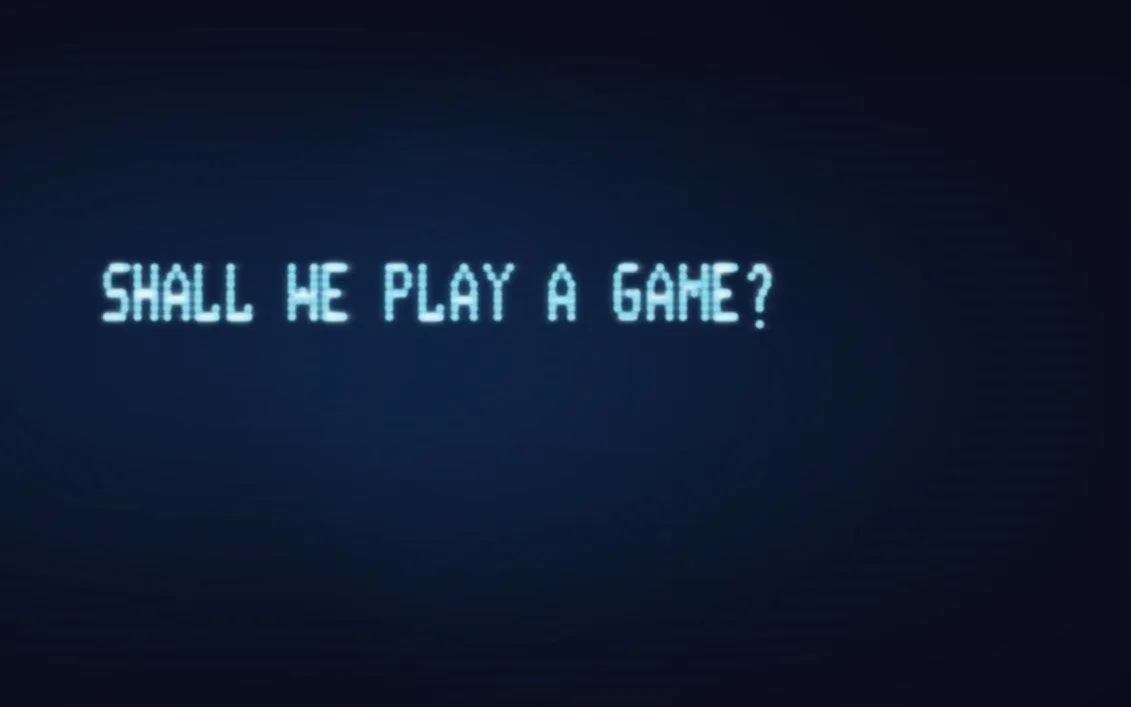 Text on a retro computer screen: "Shall we play a game?"