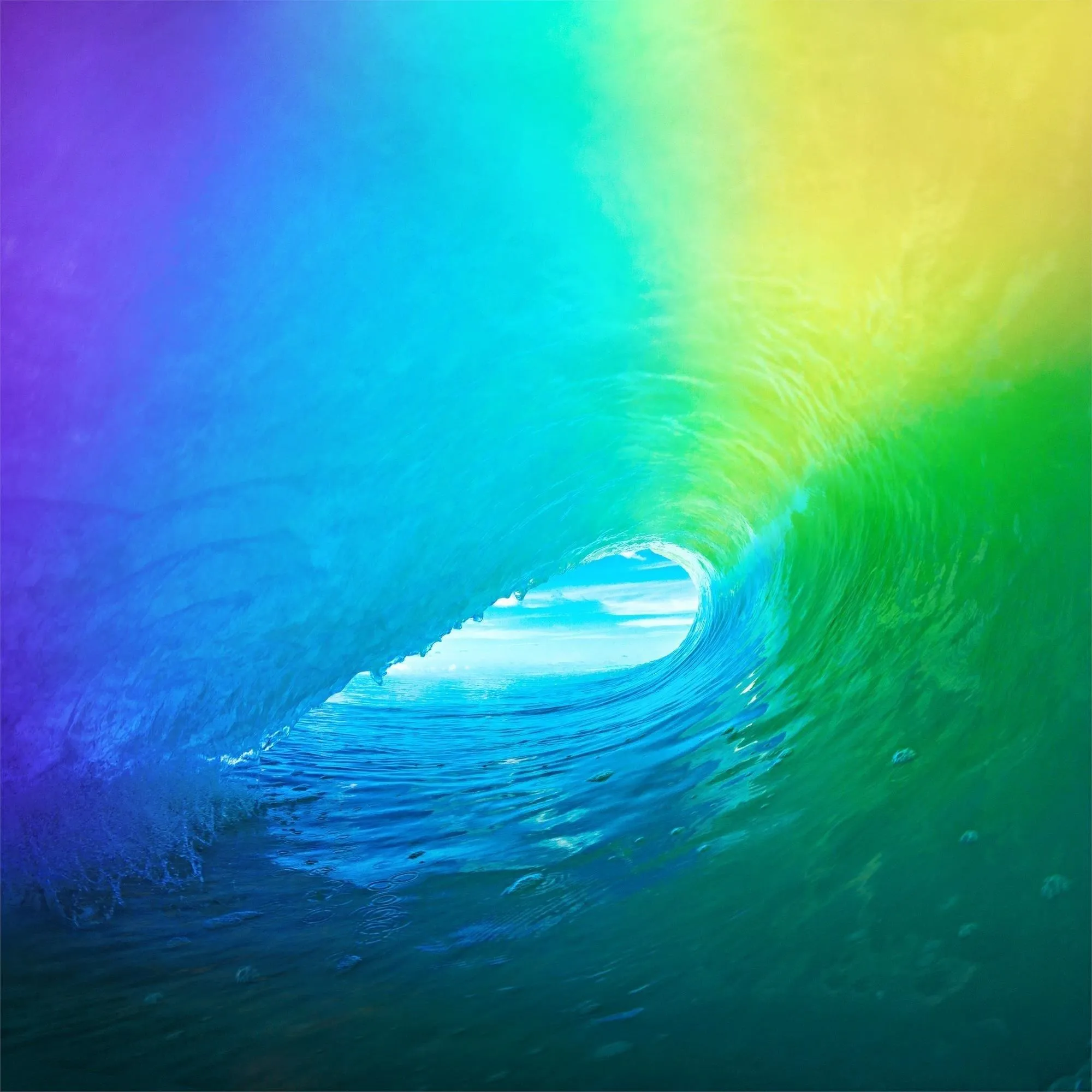 Colorful ocean wave with a light breaking through.