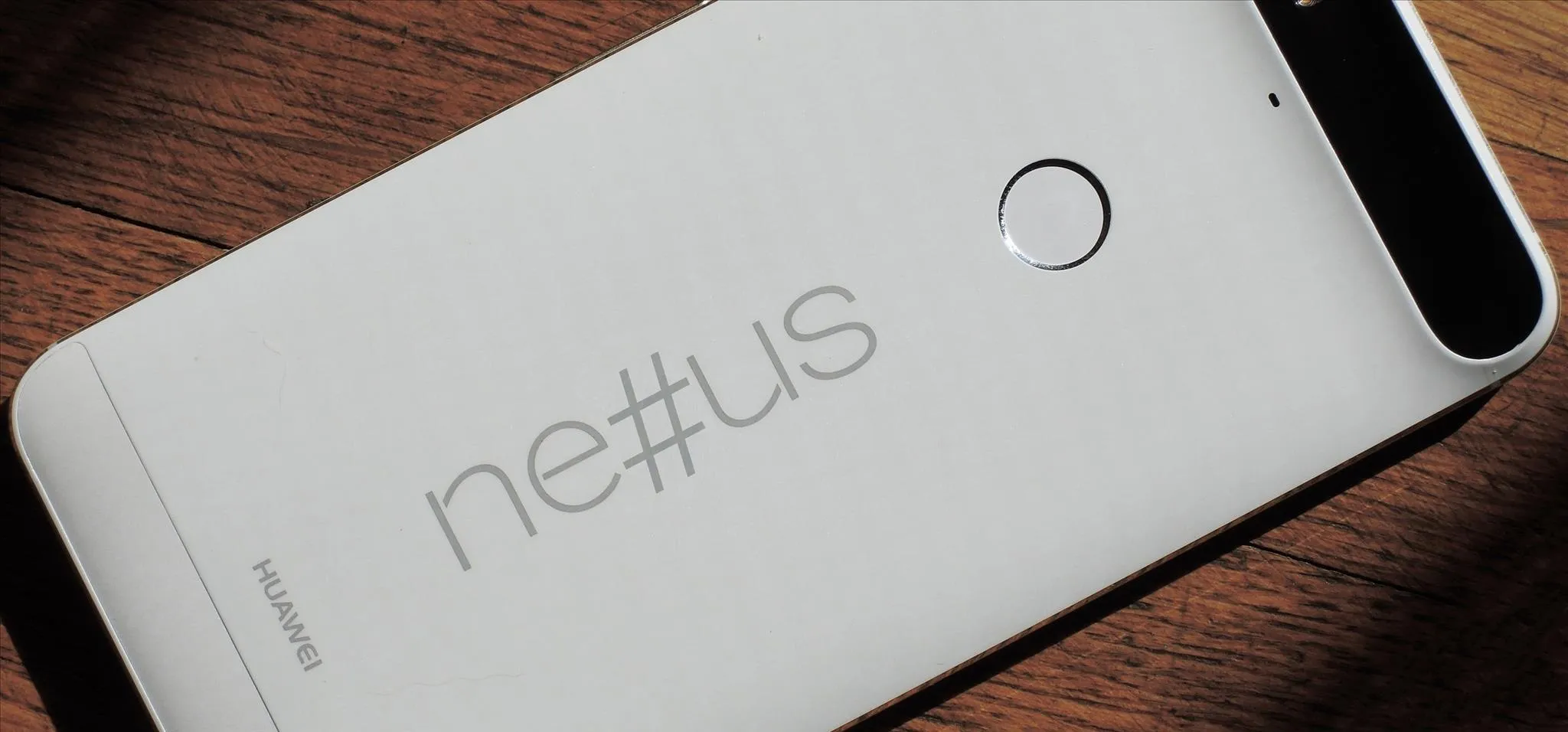 Nexus smartphone on a wooden surface.