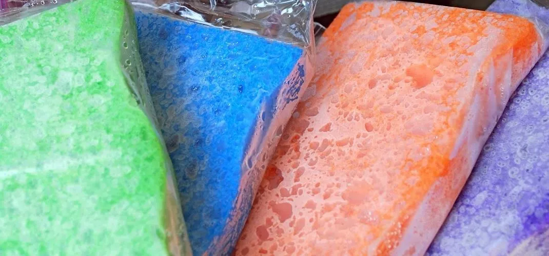 Colorful bars of soap in green, blue, orange, and purple.