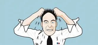 Frustrated businessman pulling his hair.