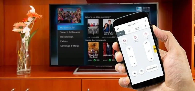 Person using a smartphone to control a smart TV.