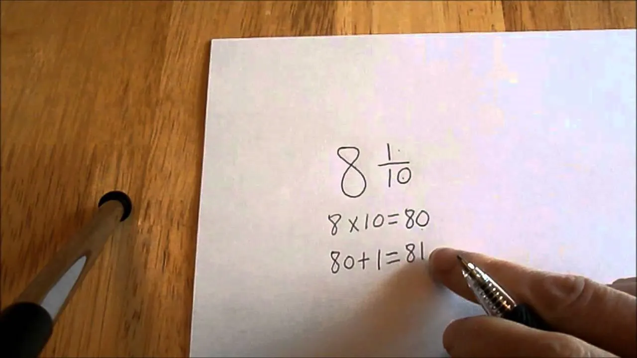 Teacher writing on a blackboard with mathematical equations and a table.