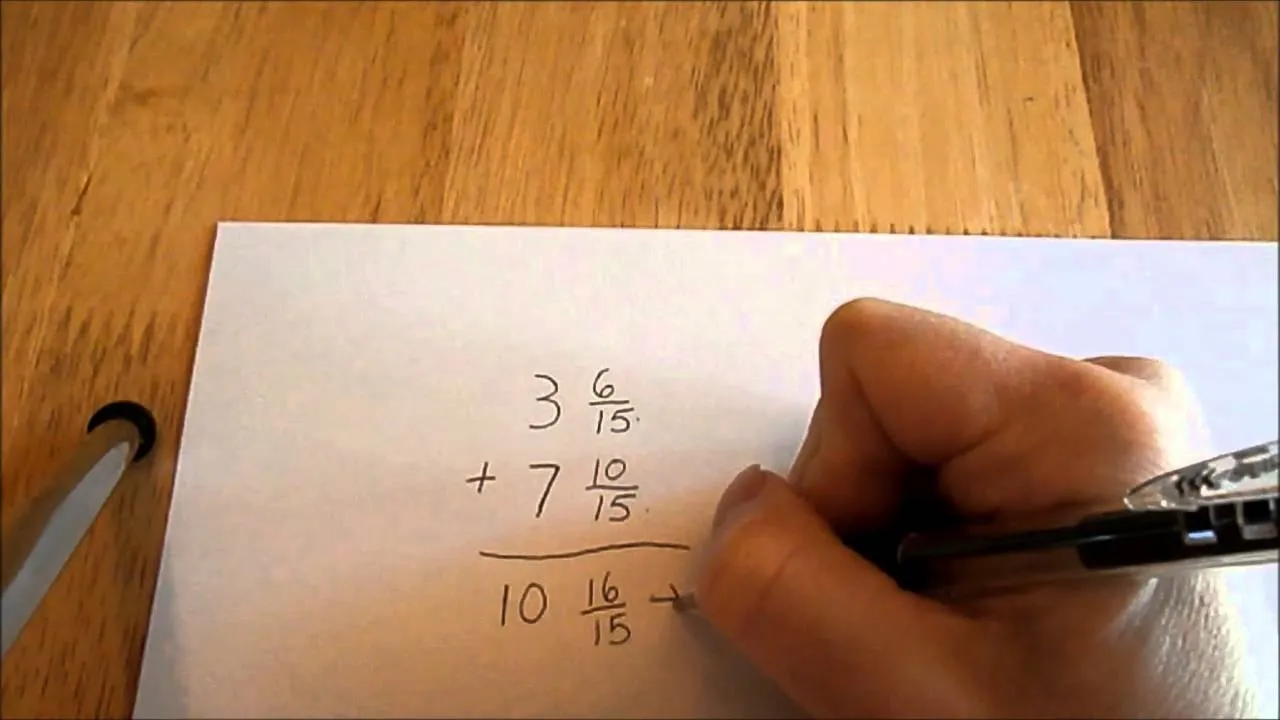 Teacher writing on a blackboard with mathematical equations and a table.