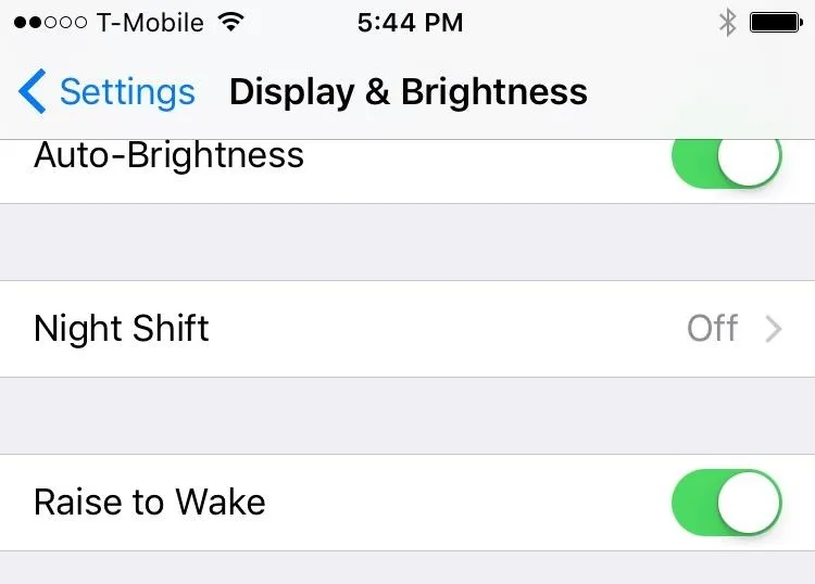 Settings menu showing Display & Brightness options on a mobile device.