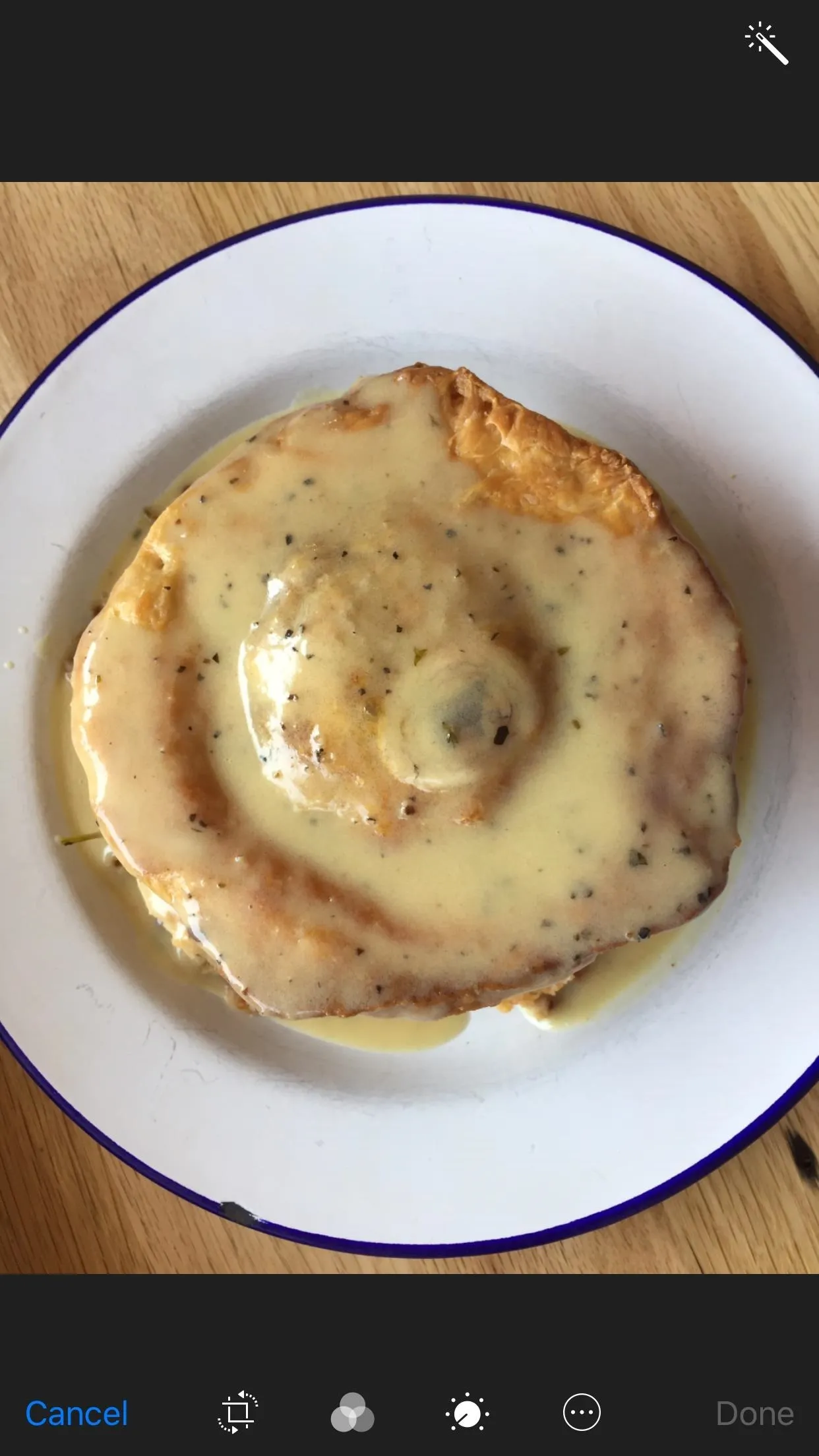 Biscuits and gravy on a plate.