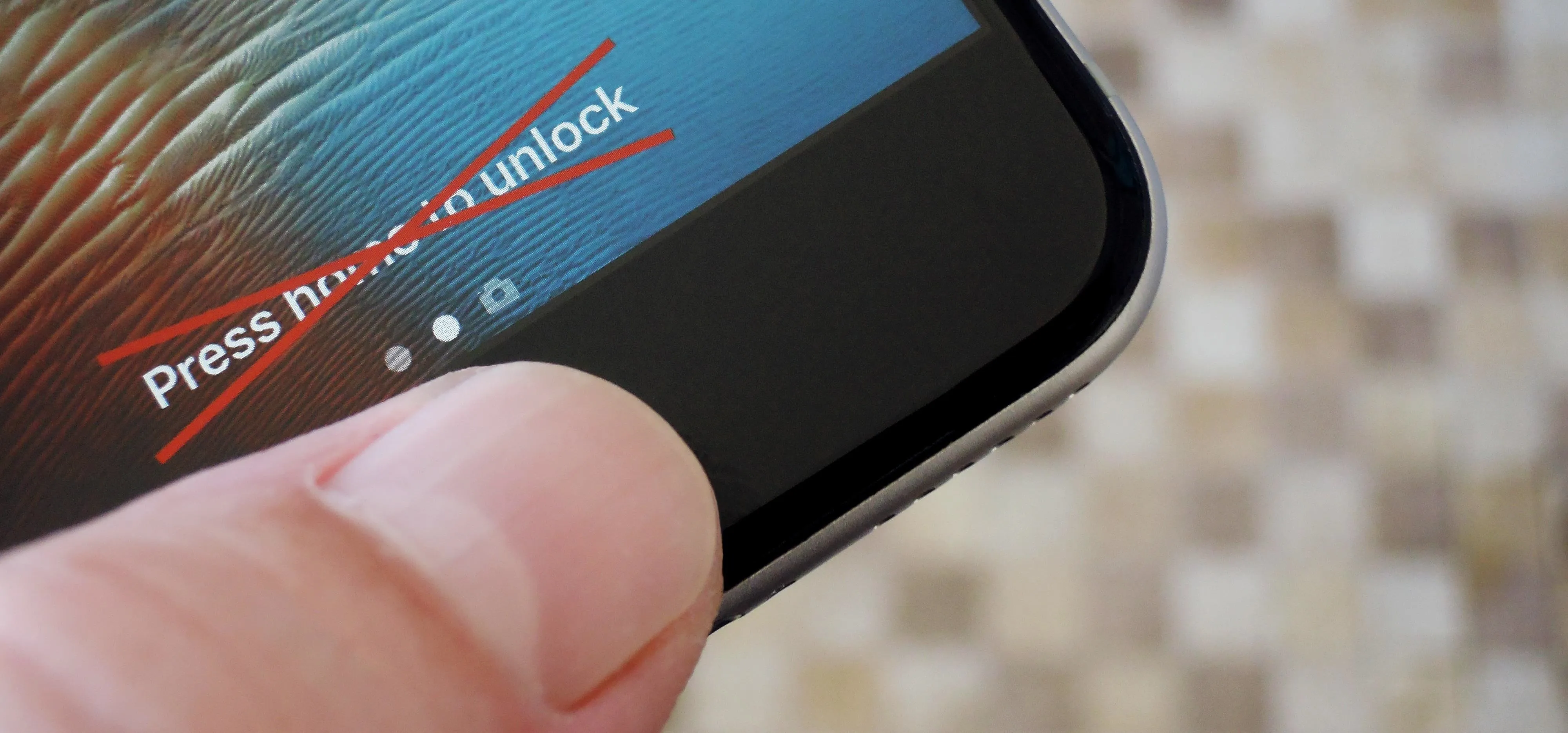 Close-up of a finger attempting to unlock a smartphone screen.