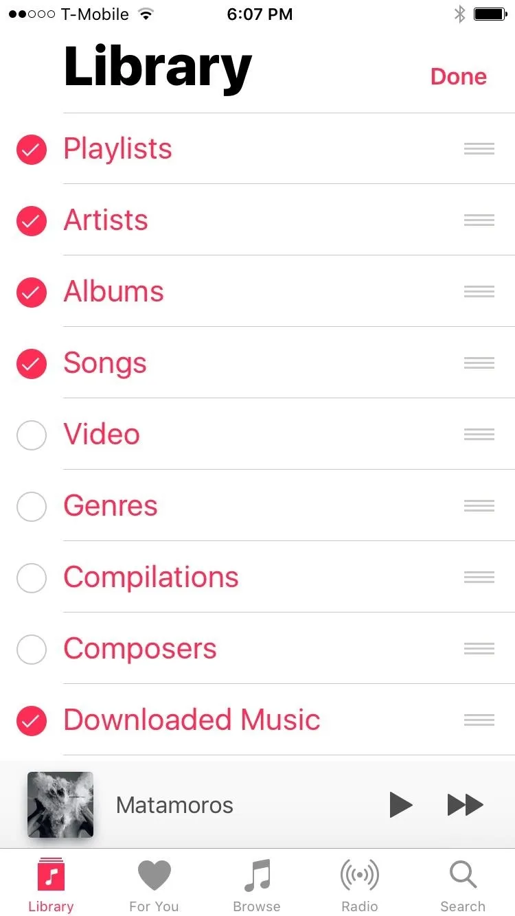 Screenshot of a music library interface displaying playlists, artists, albums, songs, videos, genres, collections, composers, and downloaded music.