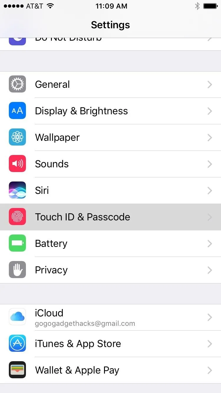 Settings menu on an iPhone displaying options for General, Display & Brightness, Sounds, and more.