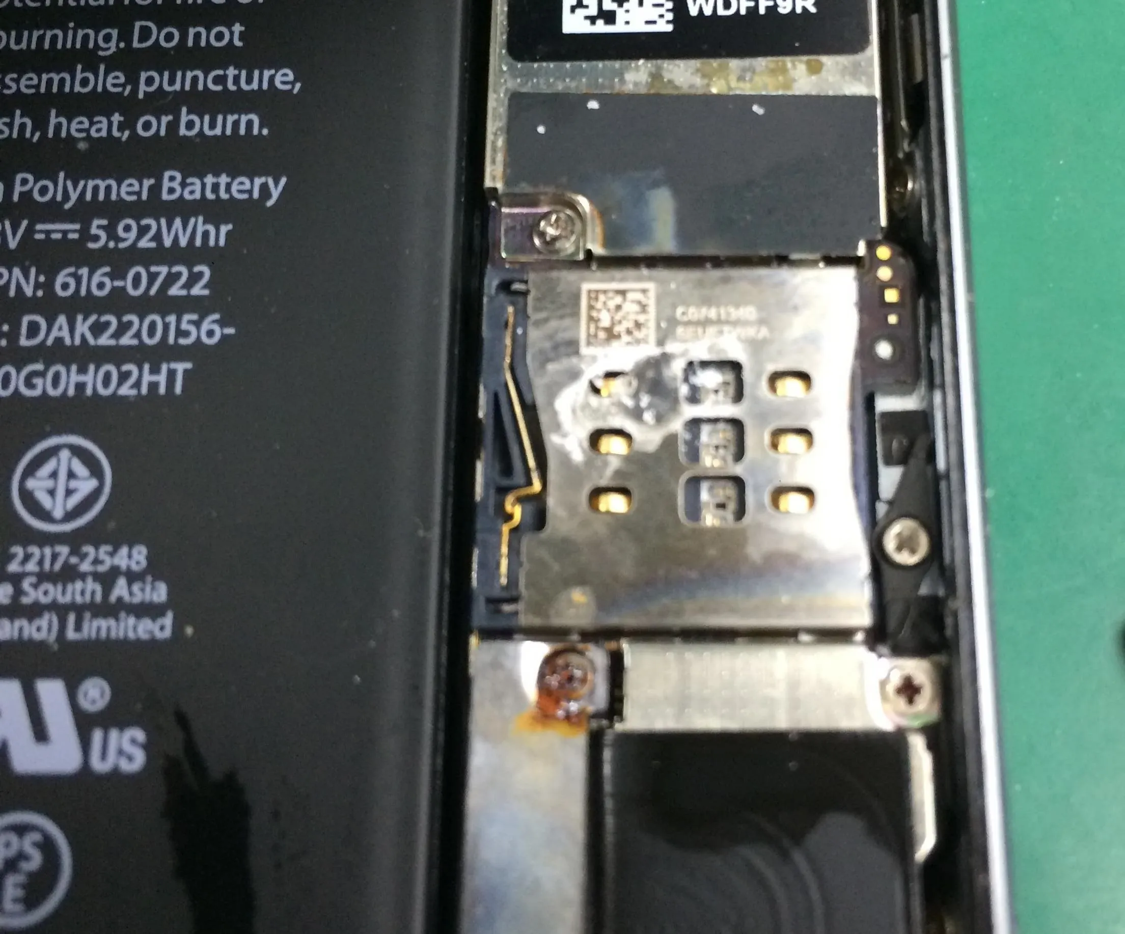 Smartphone internal components showcasing the battery and circuit board.