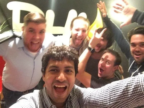 Group of six friends posing for a lively selfie.