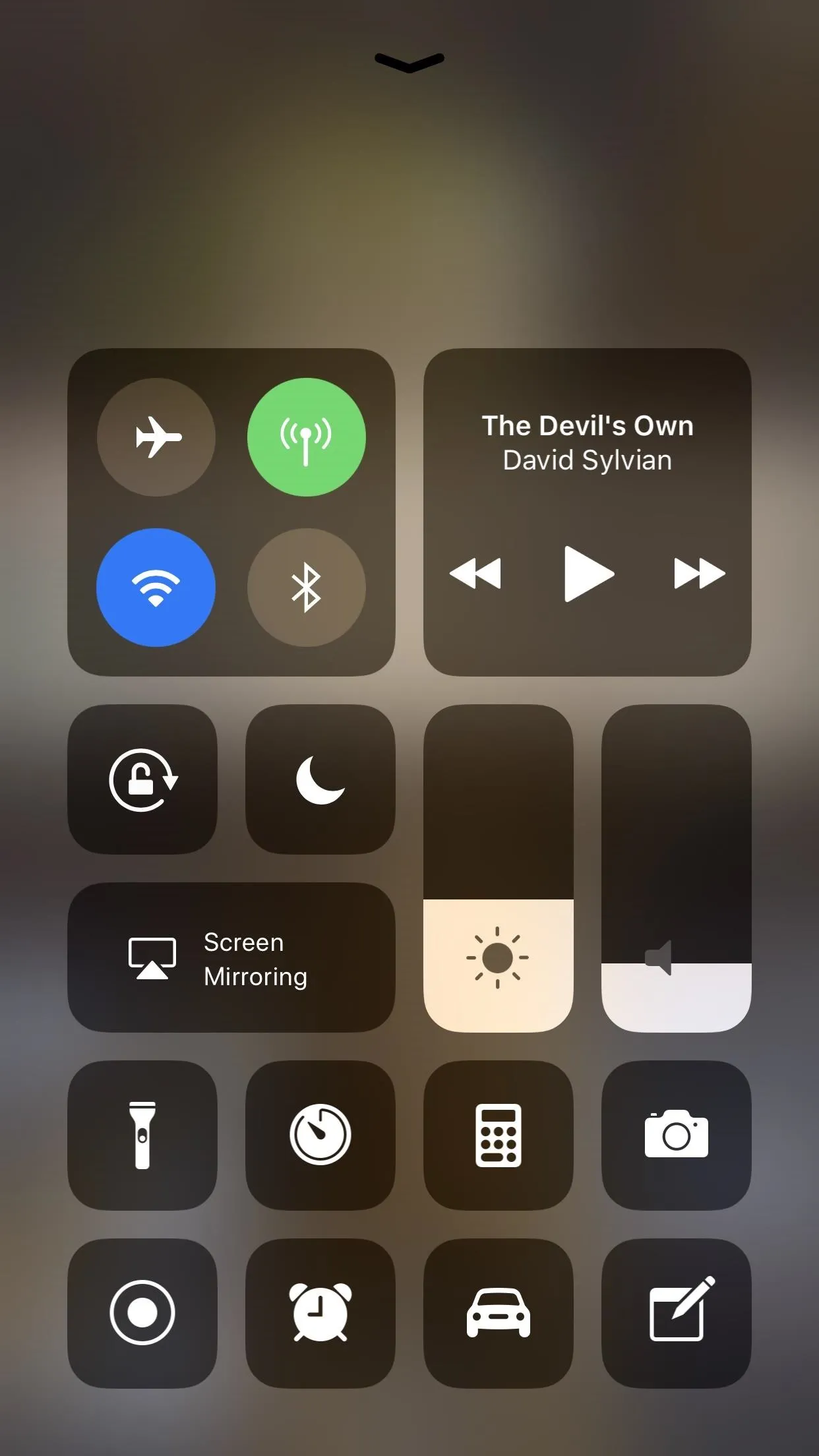 Control center interface on a smartphone displaying various settings and media controls.