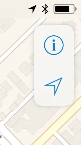 Map interface showing information icon and a navigation arrow.