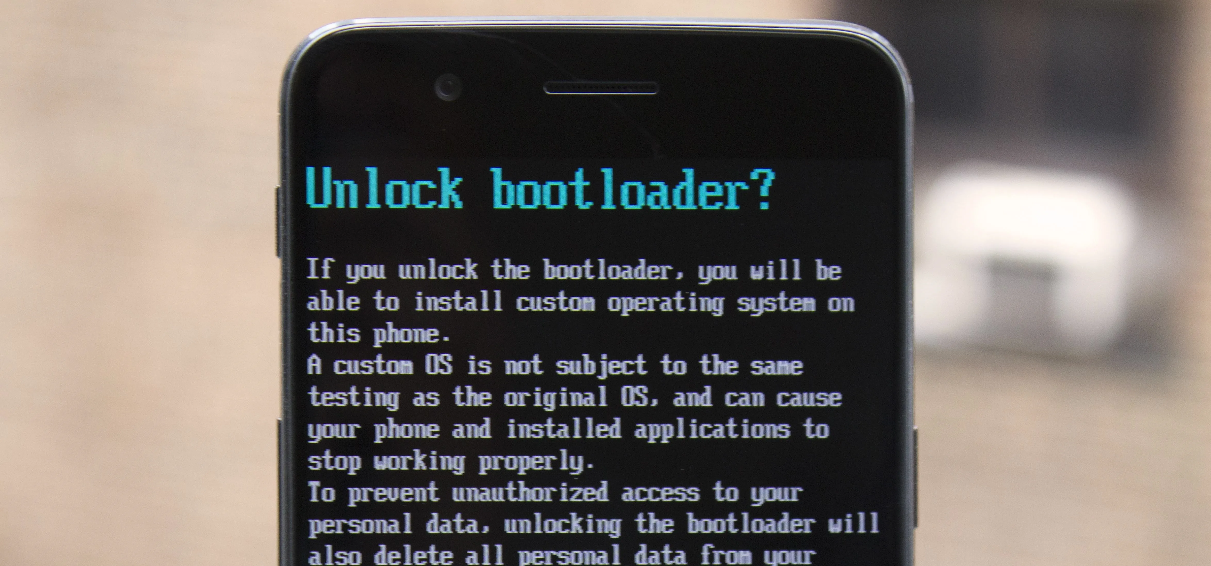 Unlock bootloader screen with warning about potential data loss and custom operating systems.