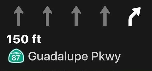 Directional road sign for Guadalupe Parkway with distance indication of 150 feet.